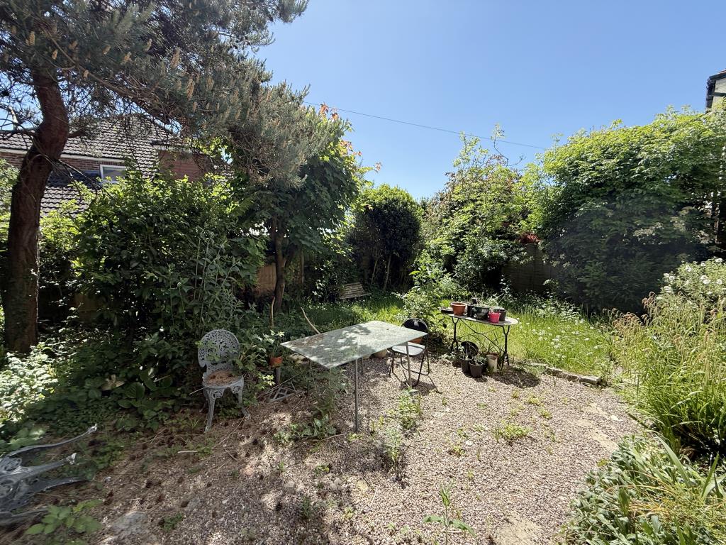 Lot: 37 - DETACHED HOUSE FOR IMPROVEMENT - Back garden of detached four bedroom house